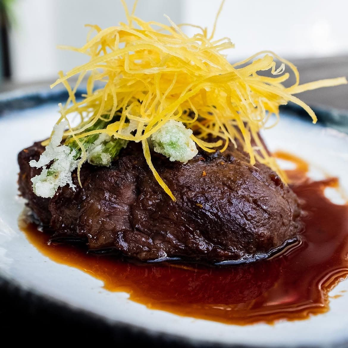 260g Angus USDA graded rib eye steak with spicy teriyaki, topped with crispy taro.